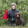 Merganser's Glenhoma Tsunami QA2 (Sioux) and Dianne with a Qualifying 2nd place at the Shasta Cascade Retriever Club Field Trial in Junction City, OR on May 2, 2025.