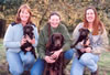 Teresa Meredith, Puyallup, Washington with female Happy Face collar pup, Dianne with Google, and Melissa O'Brien, Haskell, Texas with female Zebra collar pup. Pups are age 8 weeks, November 2006.