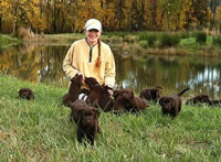 Dianne socializing our Bentley/Dish and Matlock/Billie puppies 10/21/03. Life doesn't get much better than this! (94kb)